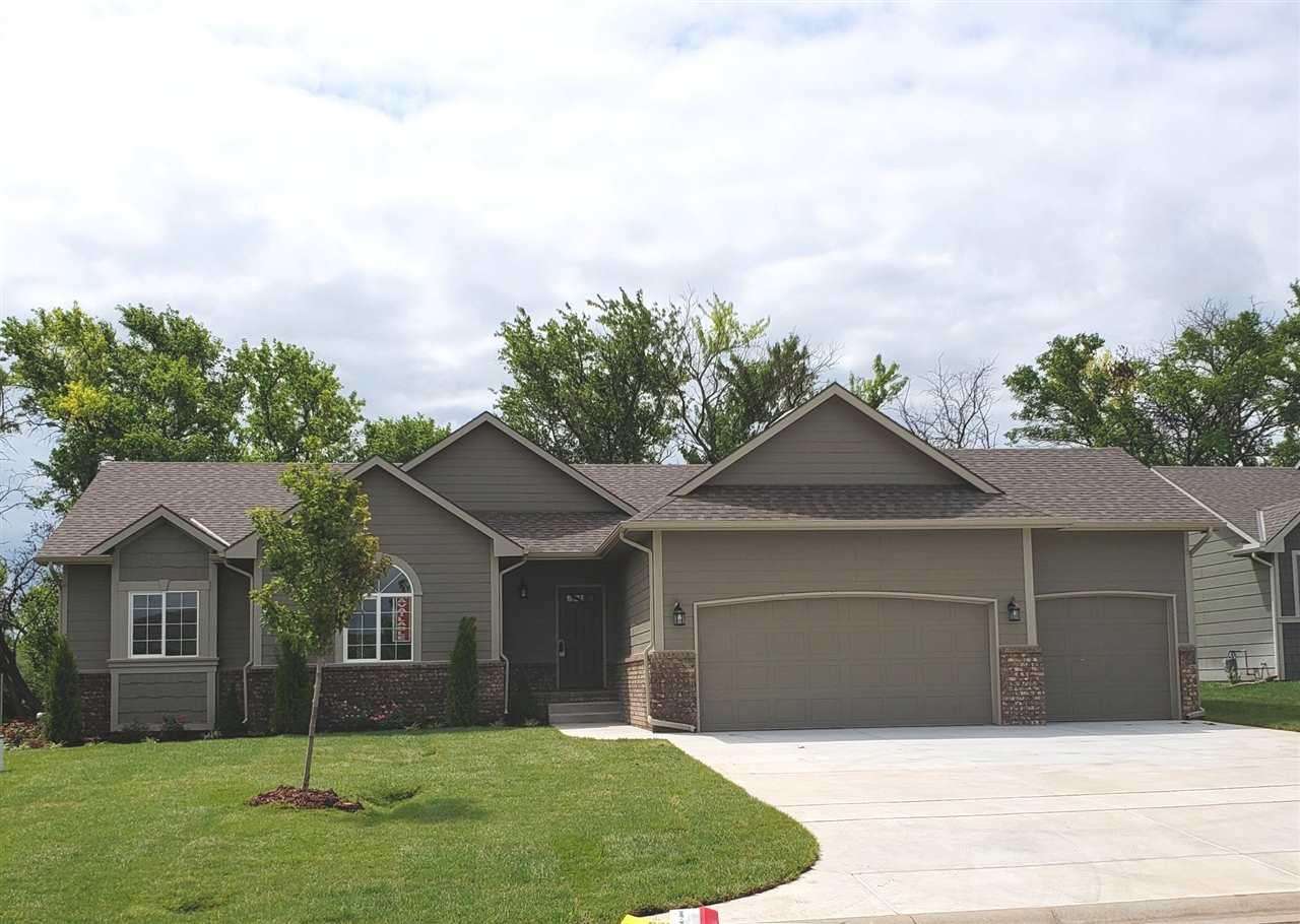This brand new ranch has all the bells and whistles. Fully completed basement give lots of extra room to enjoy. The home backs up to a tree row, and it sits in a country setting of low traffic, no high electric wires, no trains or flight patterns, yet close to HWY 96, Andover YMCA, Dillon's Marketplace or McConnell AFB. Neighborhood has pool and pool house, 3 lakes to enjoy with fountain or fishing, and nature trails for leisure walking or exercise. Call Linda for your private showing today and get the jump on anyone else, because the lawn completed soon!