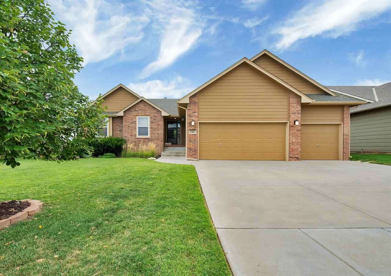Goddard Schools!  5 Bedroom, 3 Bath, 3 car Garage with a Finished, View-out  Basement, Fenced in Back Yard w/ Sprinklers!  Master Suite has Sept Soaker Tub and Shower, 2 Sinks, Large Walk-In Closet, Coffered Ceiling w/Fan & a Boxed out Window! Basement Finish includes Spacious Family/Rec Room, Bar, 4th & 5th Bedrooms & 3rd Full Bath!  Main Floor Features a Gas Fireplace, Stainless Steel Appliances, Bay Window/Door in Dining Area, Hard Wood Floors, Big Eating Bar and Pantry!  Must See!