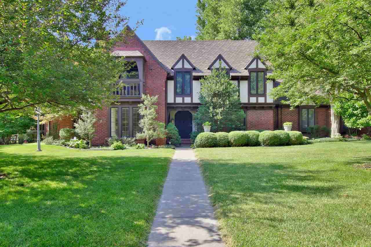 Beautiful Tudor home in Newton's Country Acres. Stunning corner lot on over 1/2 acre. Wooded with ma